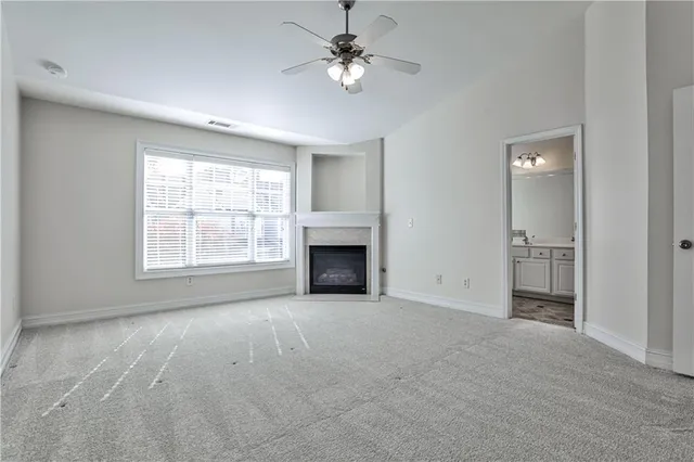 a bathroom with a bathtub a sink and a window