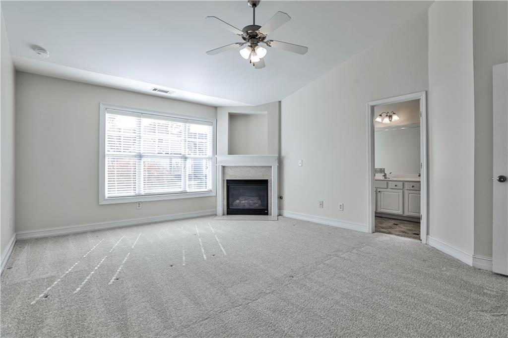 7 Reese Way Avondale Estates, GA 30002 - Photo 15 of 28 an empty room with windows and a fireplace