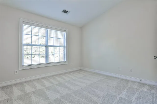 a view of a hallway with entryway and stairs