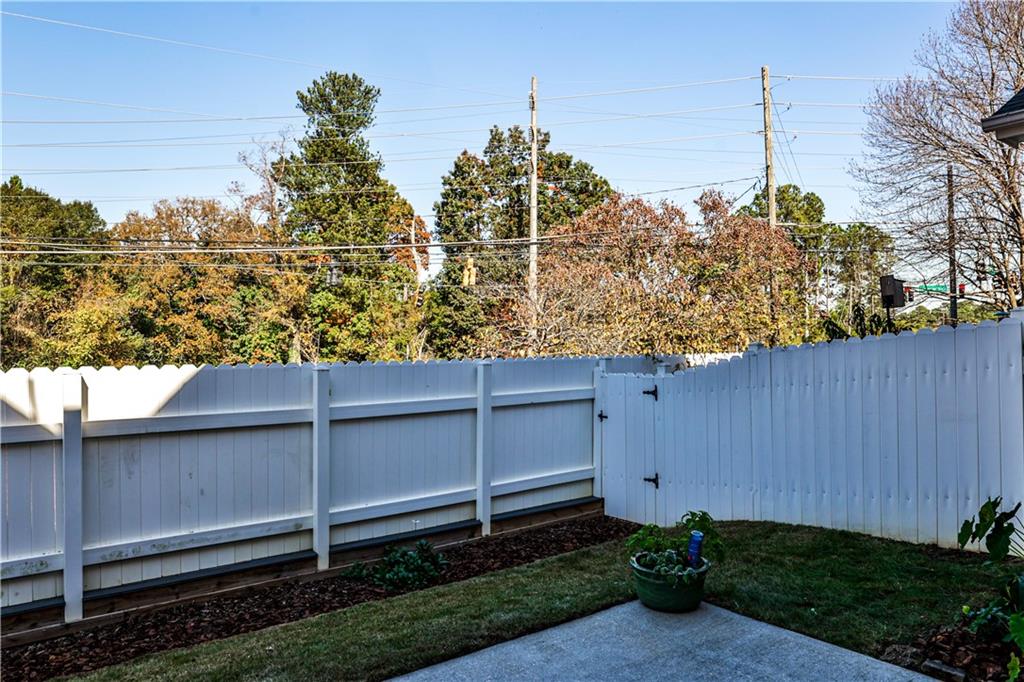 7 Reese Way Avondale Estates, GA 30002 - Photo 26 of 28 a backyard of a house with lots of green space