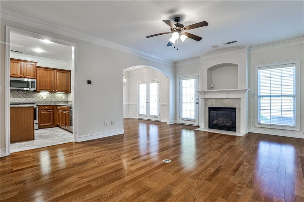 7 Reese Way Avondale Estates, GA 30002 - Photo 6 of 28 a view of an empty room with a fireplace and wooden floor