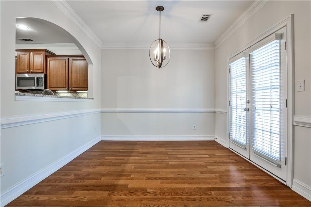 7 Reese Way Avondale Estates, GA 30002 - Photo 8 of 28 a view of empty room with wooden floor and fan