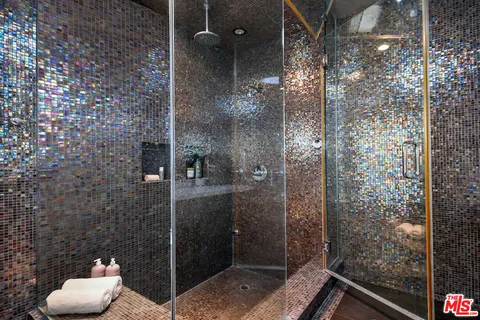 a view of a house with a snow on the road