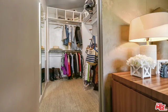 a kitchen with cabinets and window