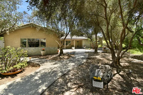 a view of a street with some trees