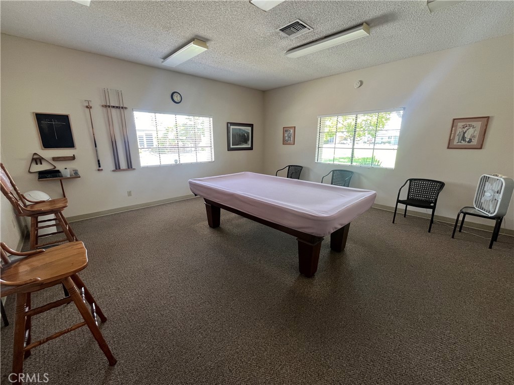 24600 Mountain Avenue, Unit 119 Hemet, CA 92544 - Photo 12 of 16 a room with furniture and windows