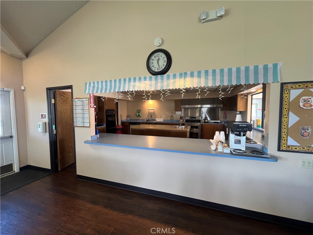 24600 Mountain Avenue, Unit 119 Hemet, CA 92544 - Photo 13 of 16 a view of a room with wooden floor and large window