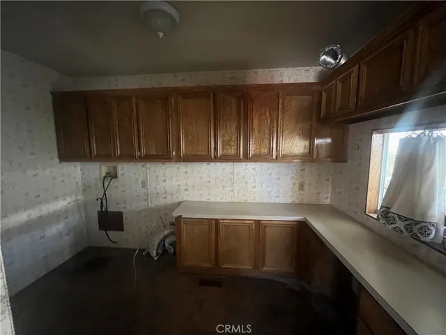 a kitchen with a sink and cabinets