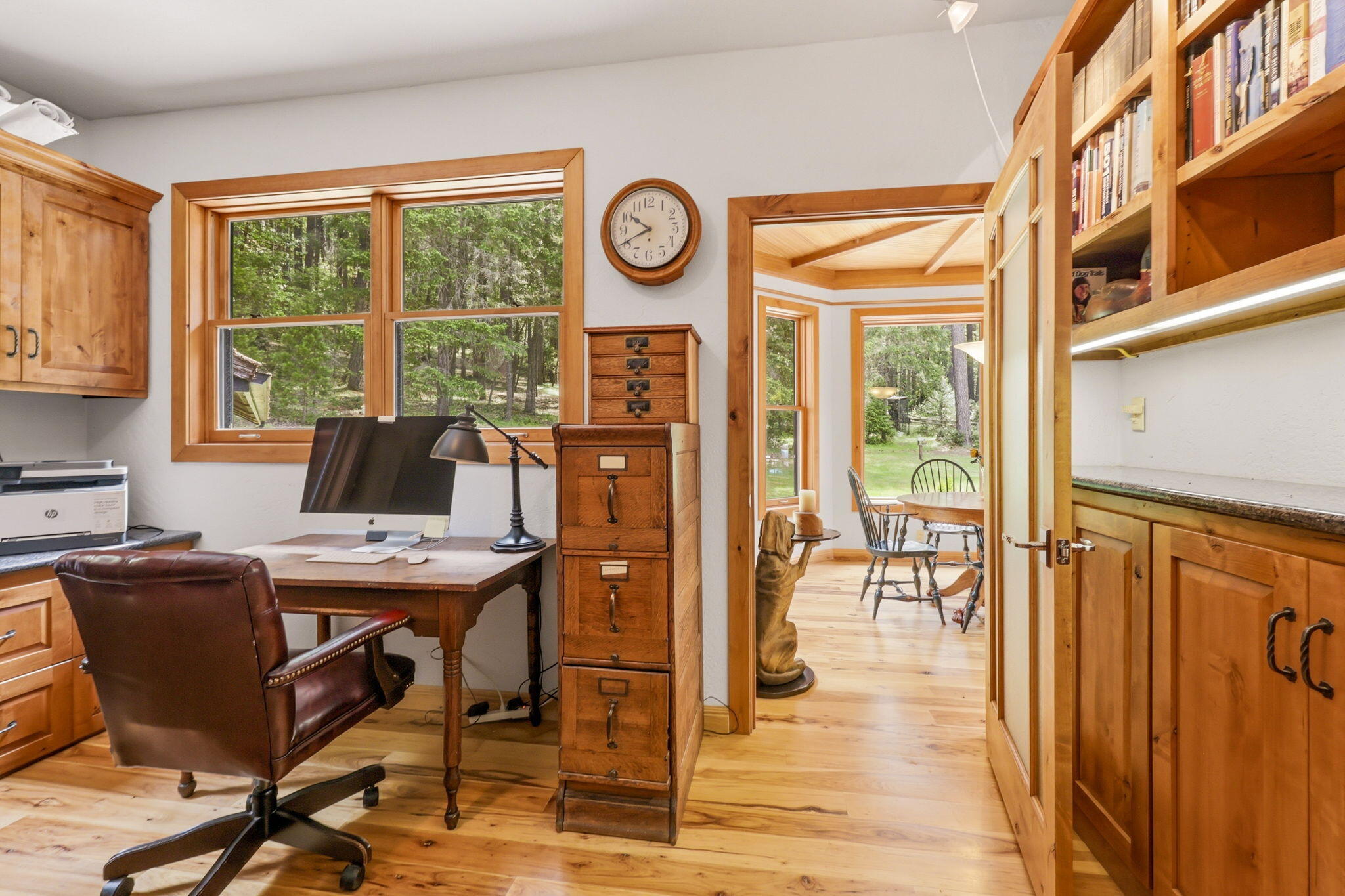 985 Elliott Creek Road Wilderville, OR 97543 - Photo 25 of 98 a view of a workspace with furniture and a window