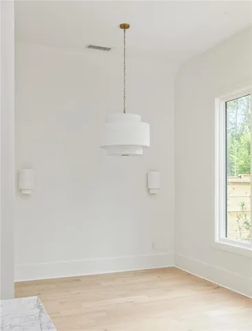 a stove top oven sitting inside of a kitchen