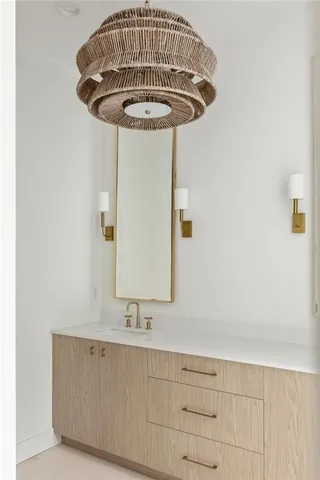 a bathroom with a double vanity sink a mirror and a bathtub