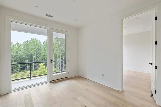a bathroom with a granite countertop toilet a sink and a mirror