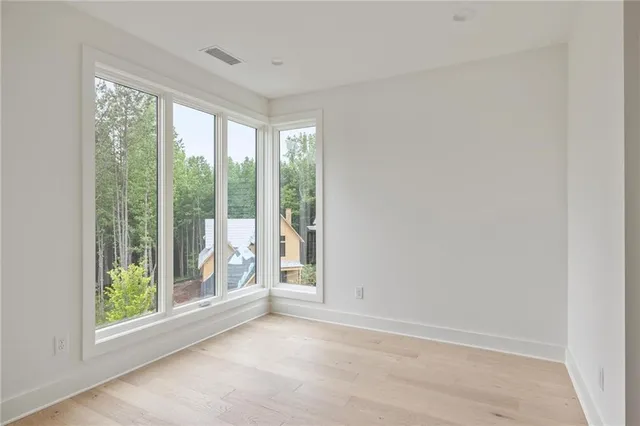 a view of a balcony with wooden floor