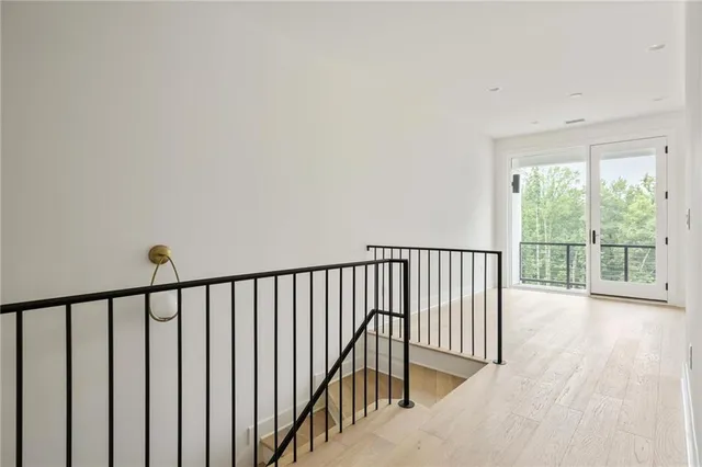 a bathroom with a granite countertop sink mirror and toilet