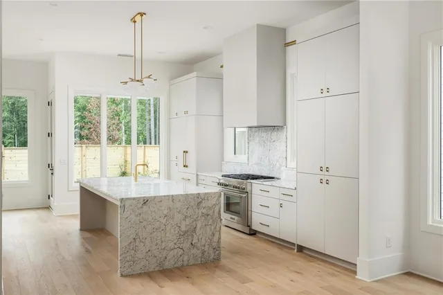 a kitchen with a window a counter top space and a fireplace