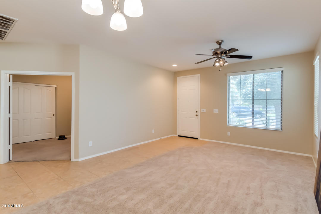 16528 West Sherman Street Goodyear, AZ 85338 - Photo 17 of 33 a view of an empty room with a window