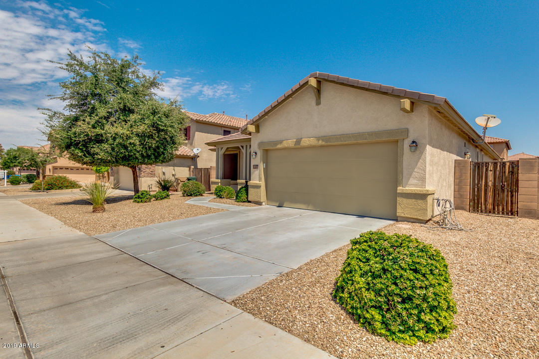 16528 West Sherman Street Goodyear, AZ 85338 - Photo 2 of 33 a view of a house with a yard