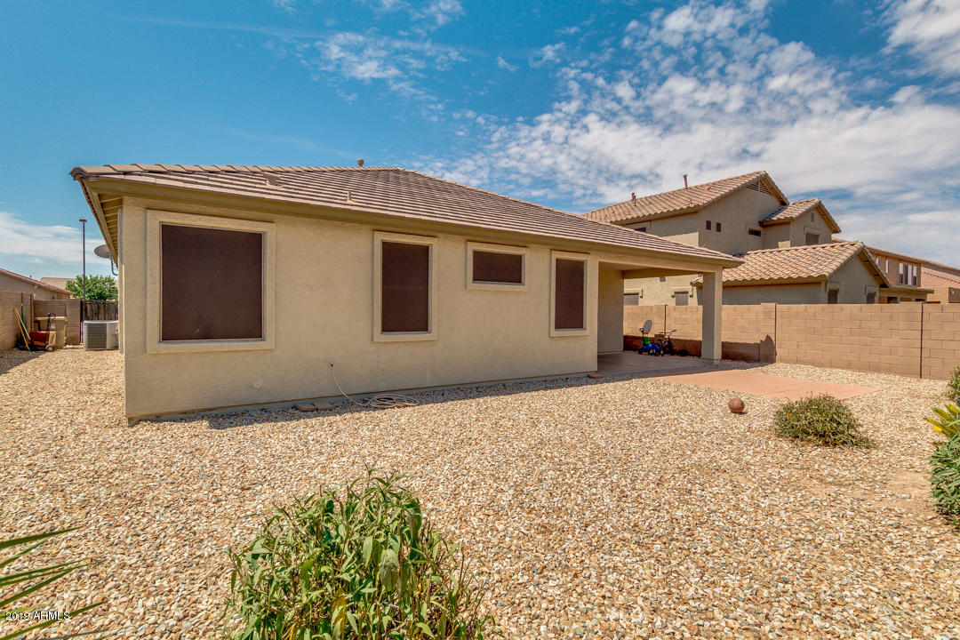16528 West Sherman Street Goodyear, AZ 85338 - Photo 29 of 33 a front view of a house with a yard