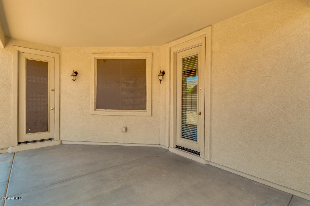 16528 West Sherman Street Goodyear, AZ 85338 - Photo 30 of 33 an empty room with windows