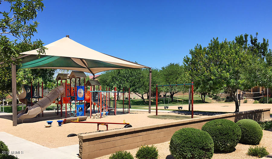 16528 West Sherman Street Goodyear, AZ 85338 - Photo 31 of 33 a view of a park with swings and slides