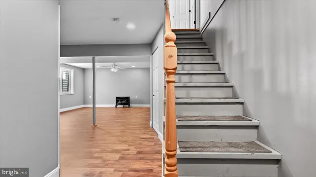 a view of entryway and hall with wooden floor