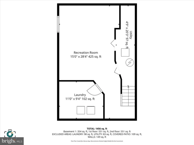 a picture of a bench in front of a wall