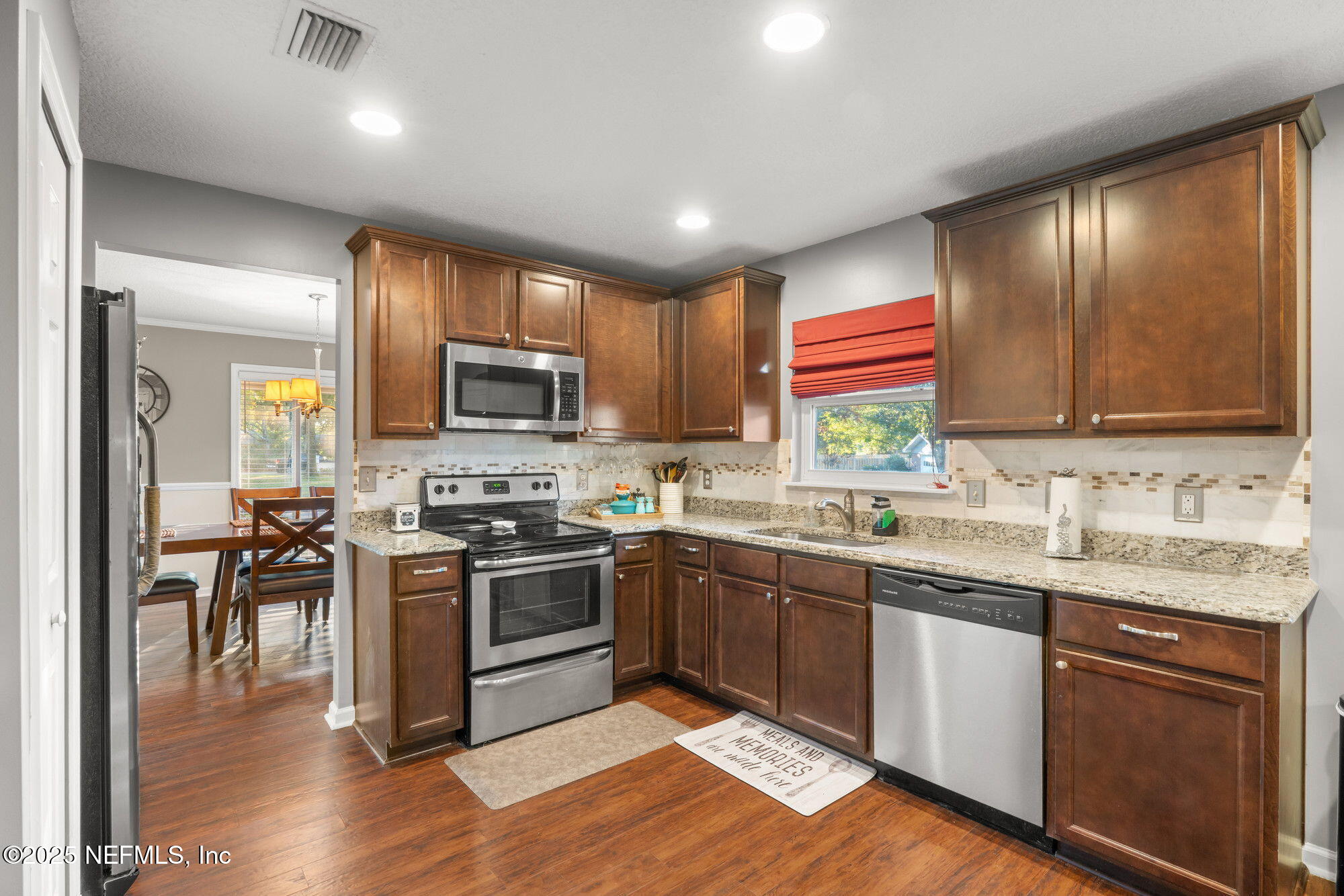 3301 Hermitage Road East Jacksonville, FL 32277 - Photo 14 of 49 a kitchen with granite countertop stainless steel appliances and sink