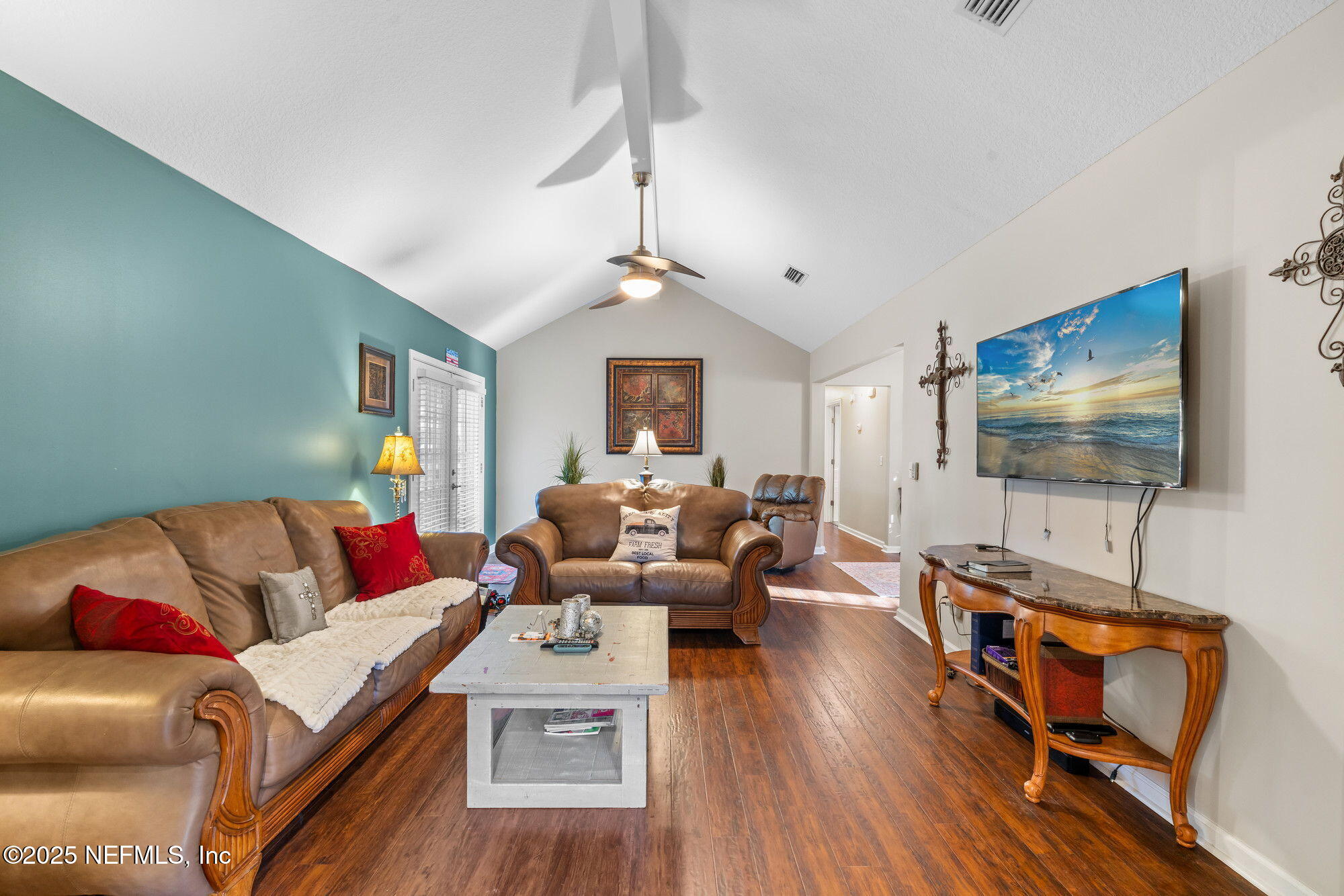 3301 Hermitage Road East Jacksonville, FL 32277 - Photo 24 of 49 a living room with furniture and a flat screen tv