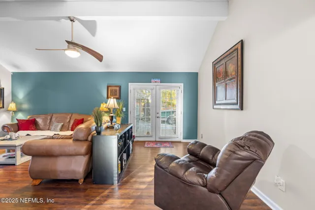 a bathroom with a granite countertop sink a toilet and a mirror