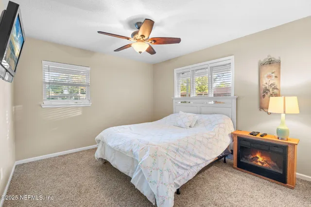 a view of house with outdoor seating area