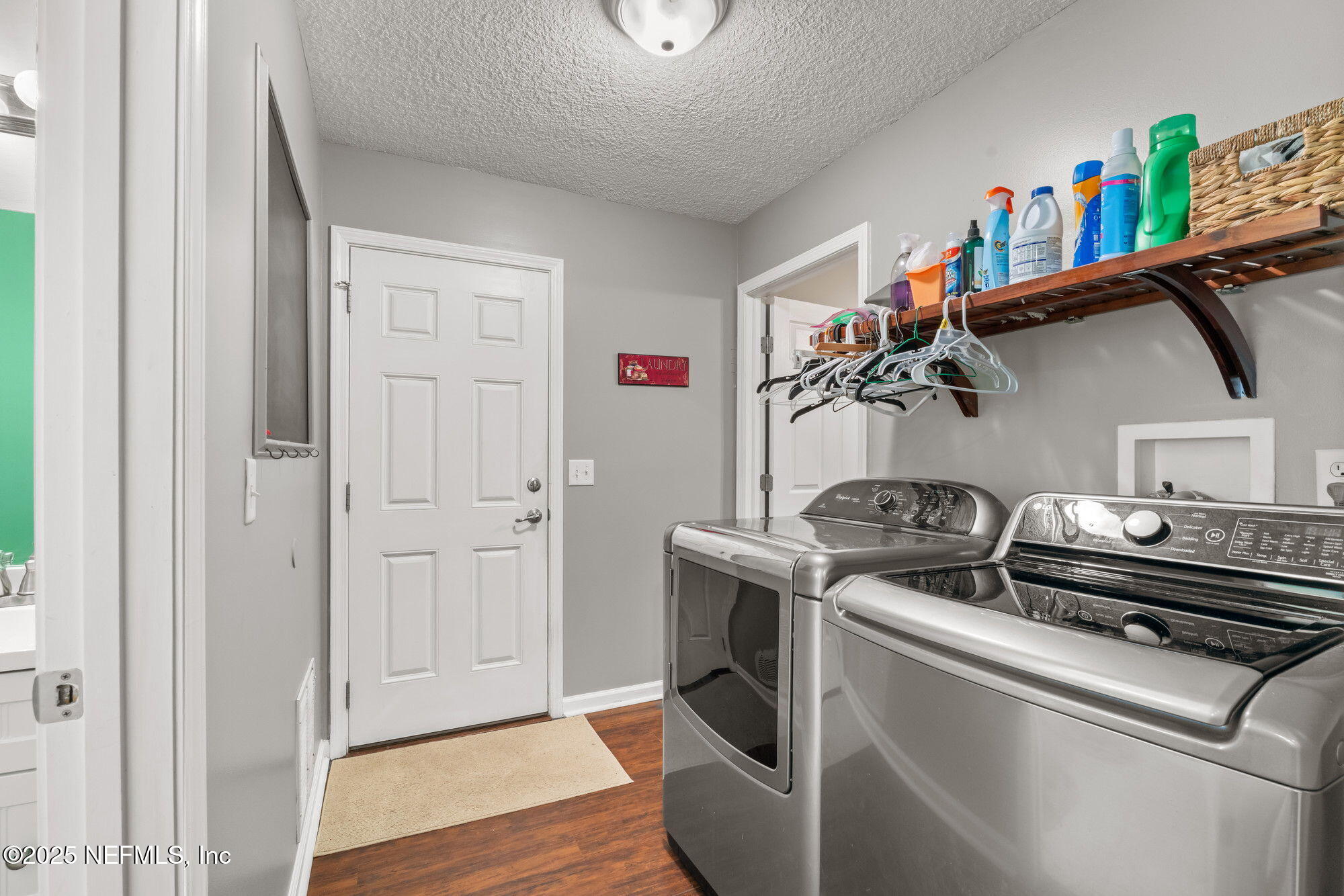 3301 Hermitage Road East Jacksonville, FL 32277 - Photo 37 of 49 a utility room with dryer washer and empty racks