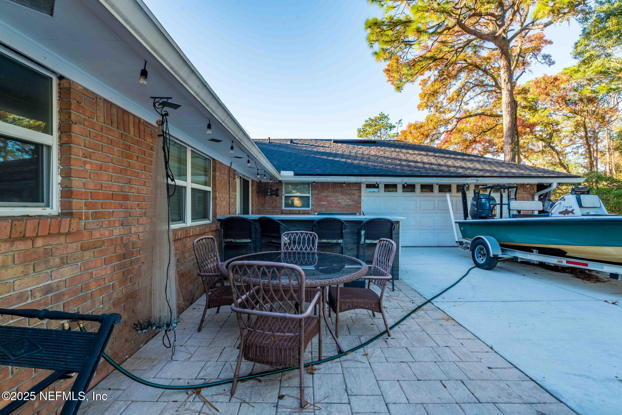 3301 Hermitage Road East Jacksonville, FL 32277 - Photo 49 of 49 a patio with glass top table and chairs