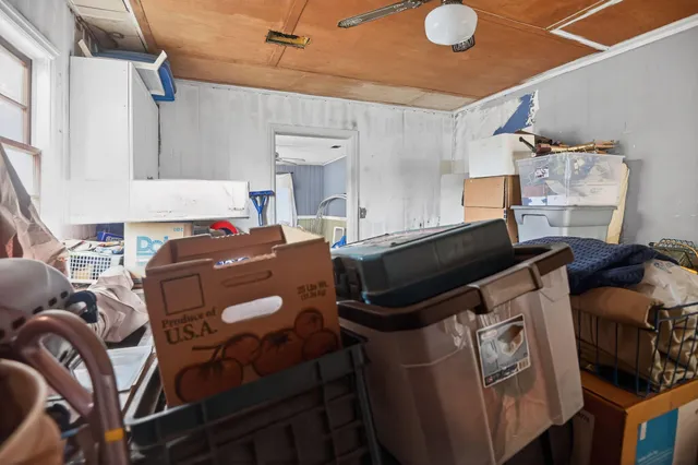a close up of a storage and utility room with racks on the wall