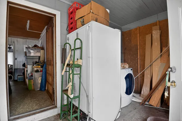 a view of an entryway with wooden floor