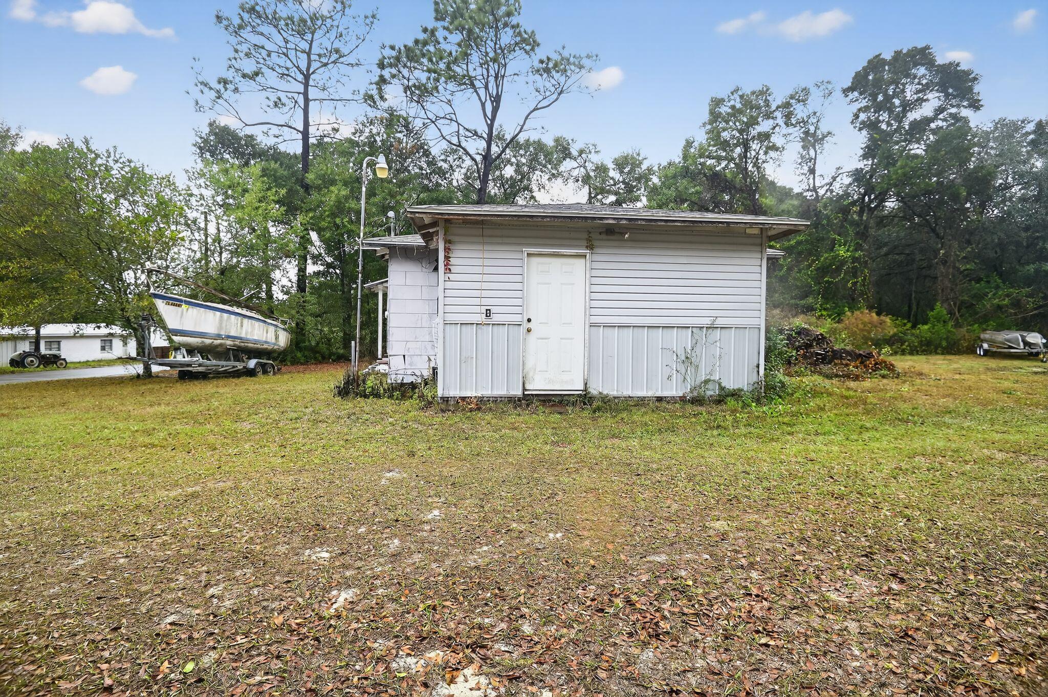 950 B Street Crestview, FL 32536 - Photo 5 of 32 a view of a house with a back yard