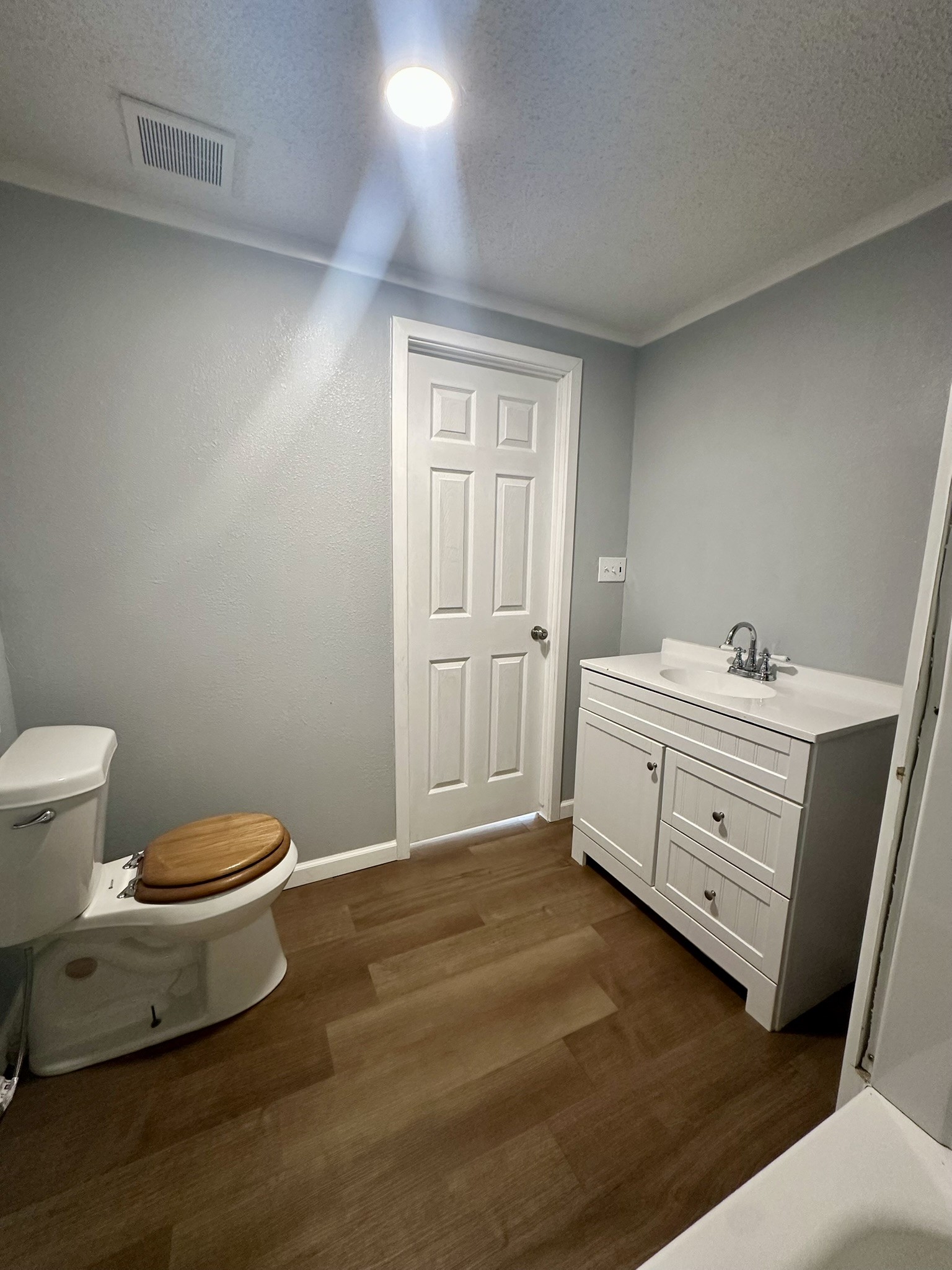 2529 Mcdonald Road Oyster Creek, TX 77541 - Photo 11 of 14 a bathroom with a toilet sink and mirror