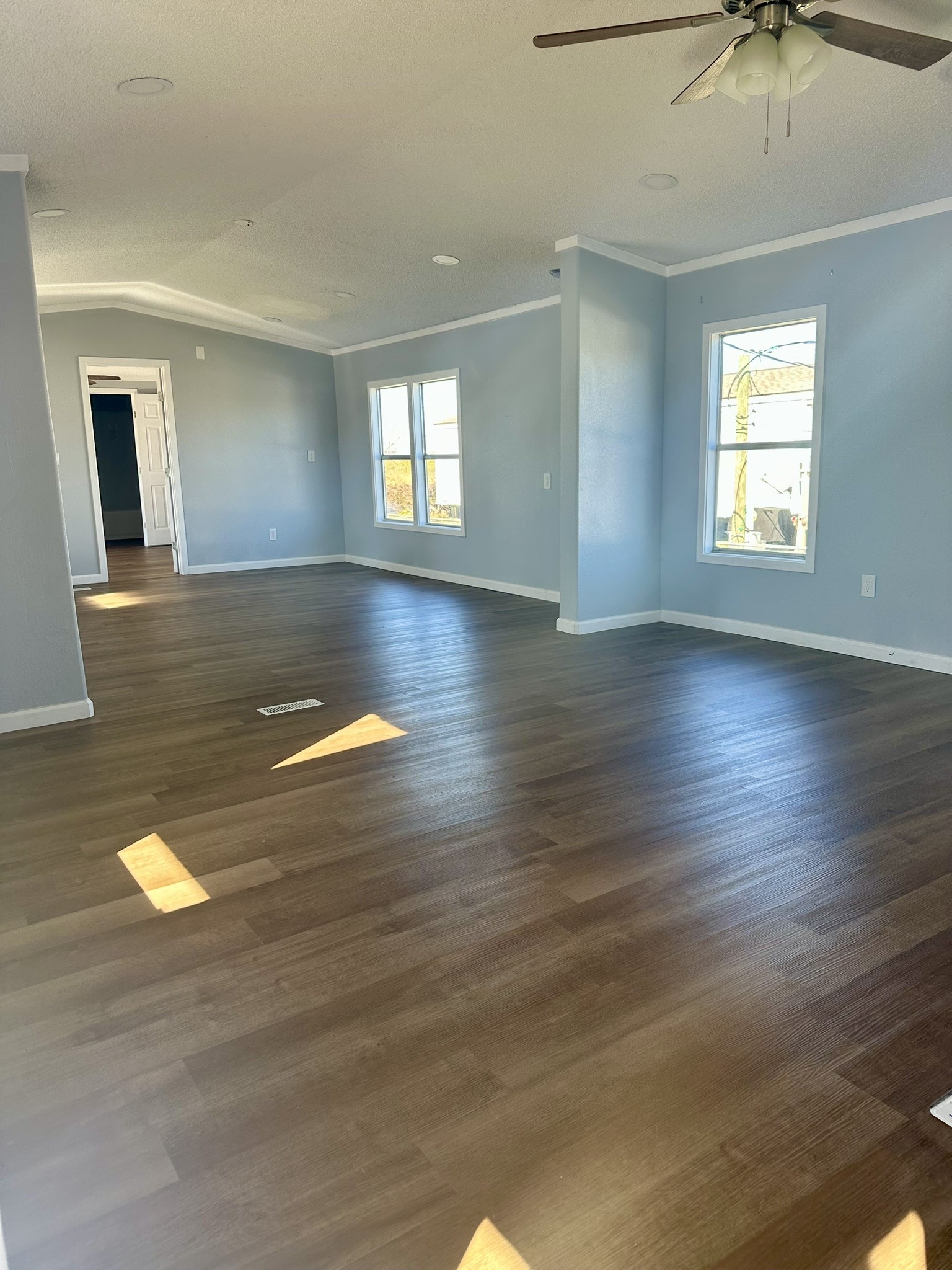 2529 Mcdonald Road Oyster Creek, TX 77541 - Photo 2 of 14 an empty room with wooden floor and windows
