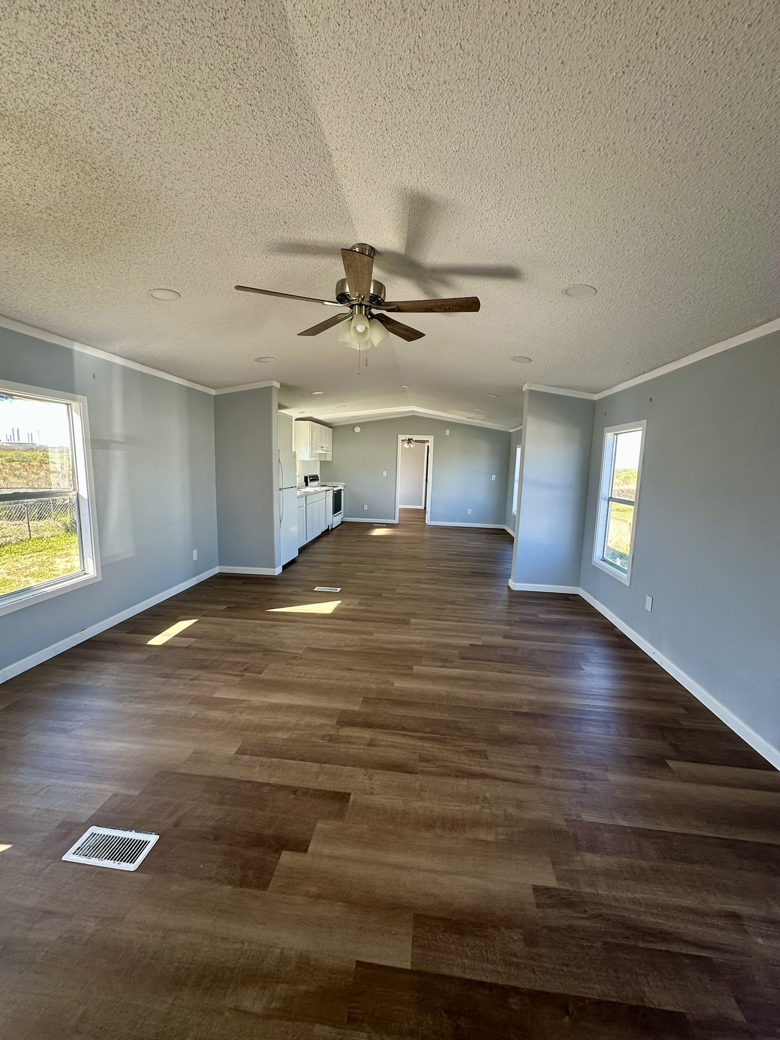 2529 Mcdonald Road Oyster Creek, TX 77541 - Photo 3 of 14 a view of an empty room with window and wooden floor
