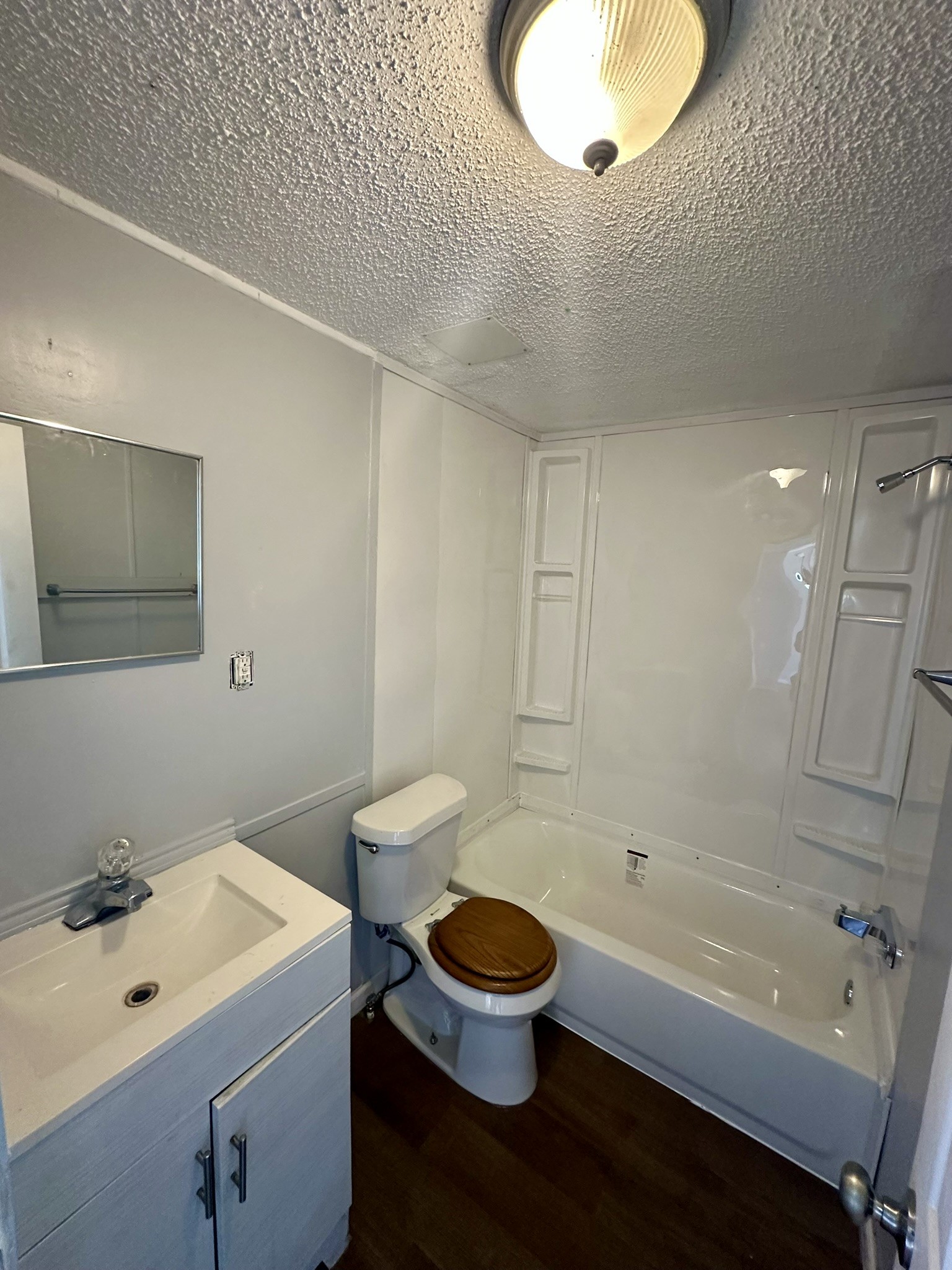 2529 Mcdonald Road Oyster Creek, TX 77541 - Photo 5 of 14 a bathroom with a sink a toilet and a bathtub
