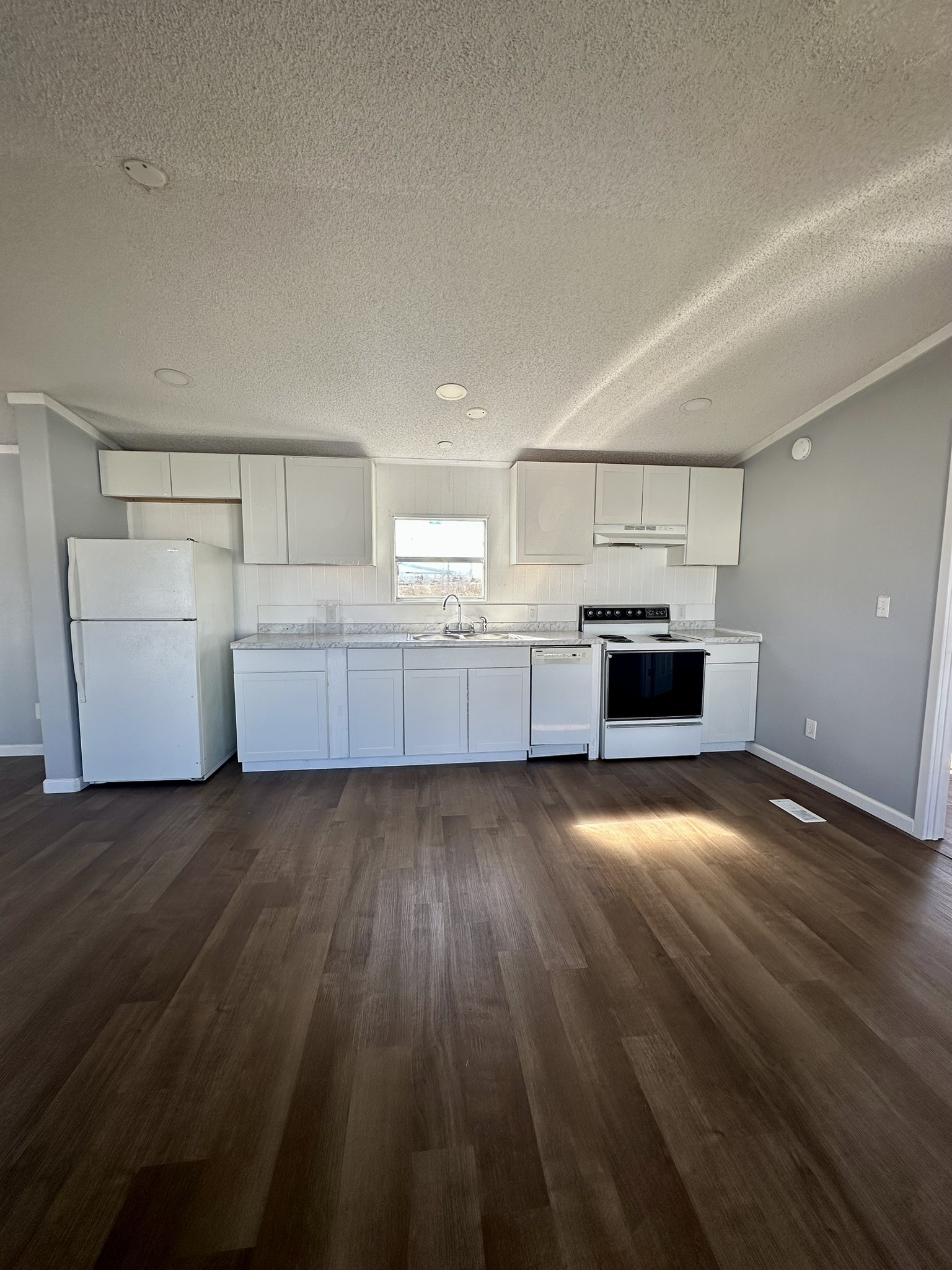 2529 Mcdonald Road Oyster Creek, TX 77541 - Photo 9 of 14 a view of kitchen and wooden floor