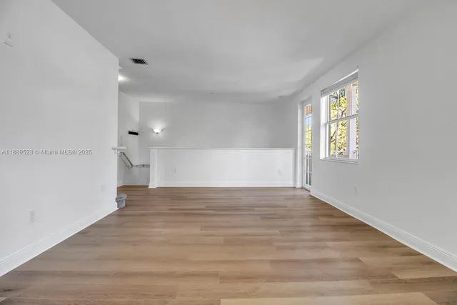 a view of an empty room and window