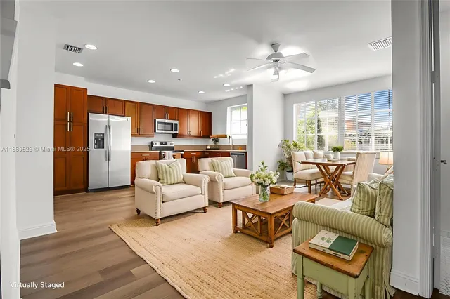 a living room with furniture fireplace and flat screen tv