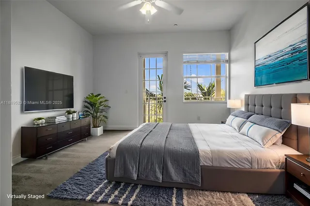 a bedroom with a bed and a flat screen television