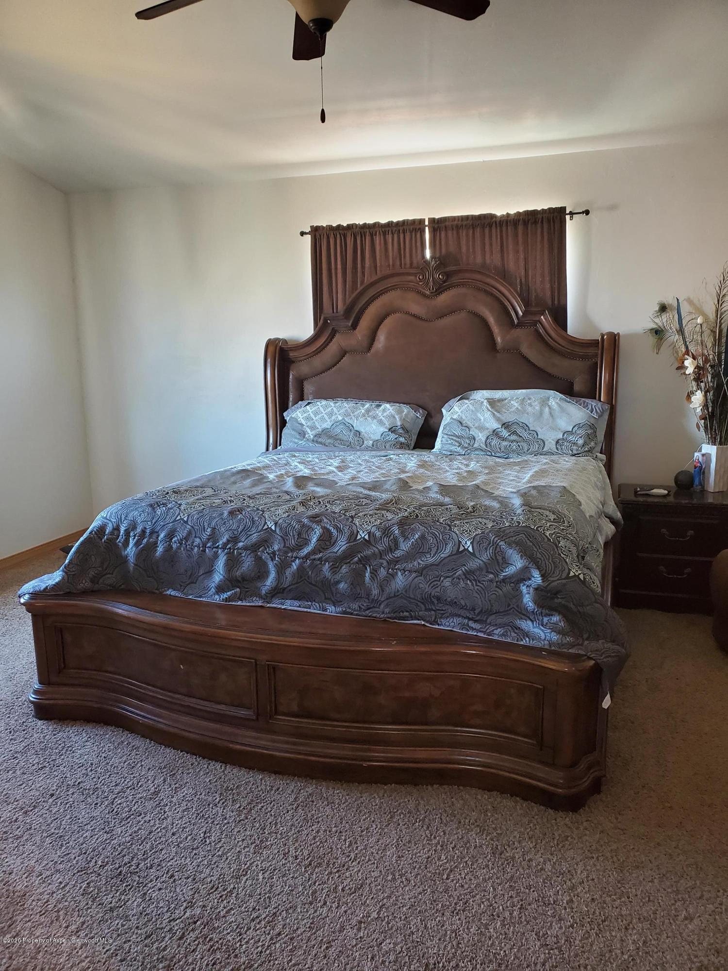 1880 Anvil Court Rifle, CO 81650 - Photo 12 of 16 a bedroom with a bed and window