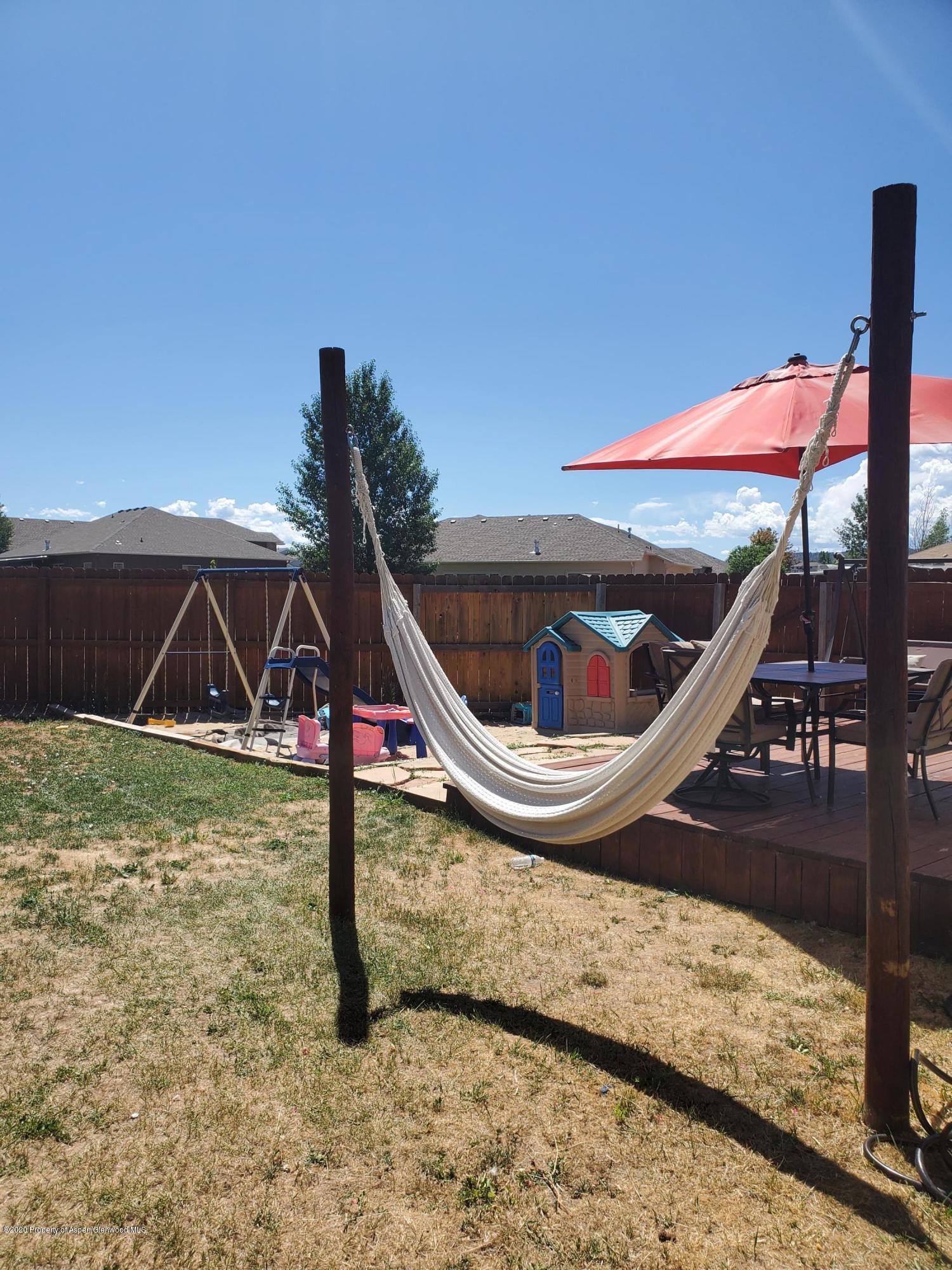 1880 Anvil Court Rifle, CO 81650 - Photo 15 of 16 a view of a wooden deck with a backyard