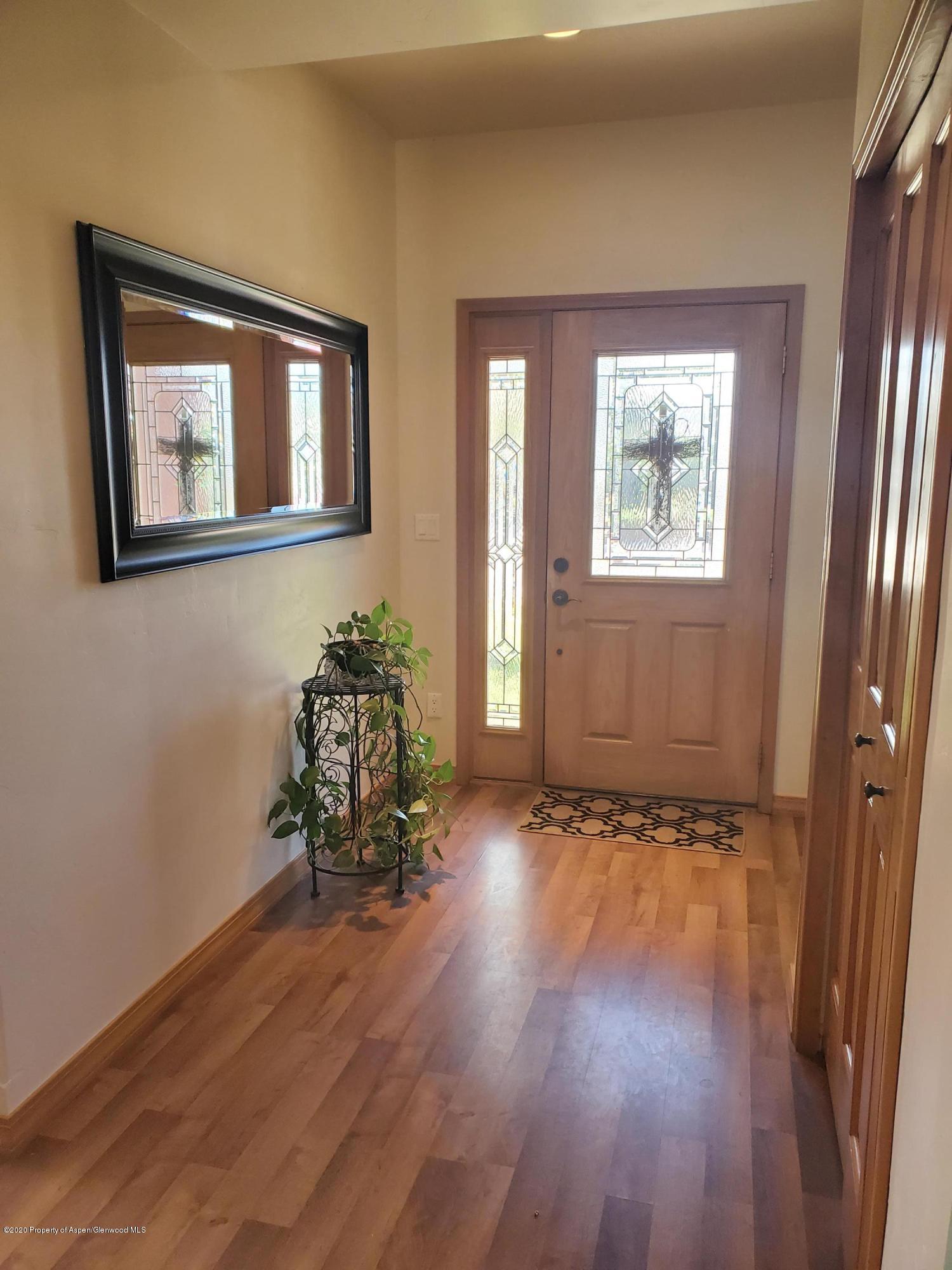 1880 Anvil Court Rifle, CO 81650 - Photo 2 of 16 a view of a room with wooden floor and a window