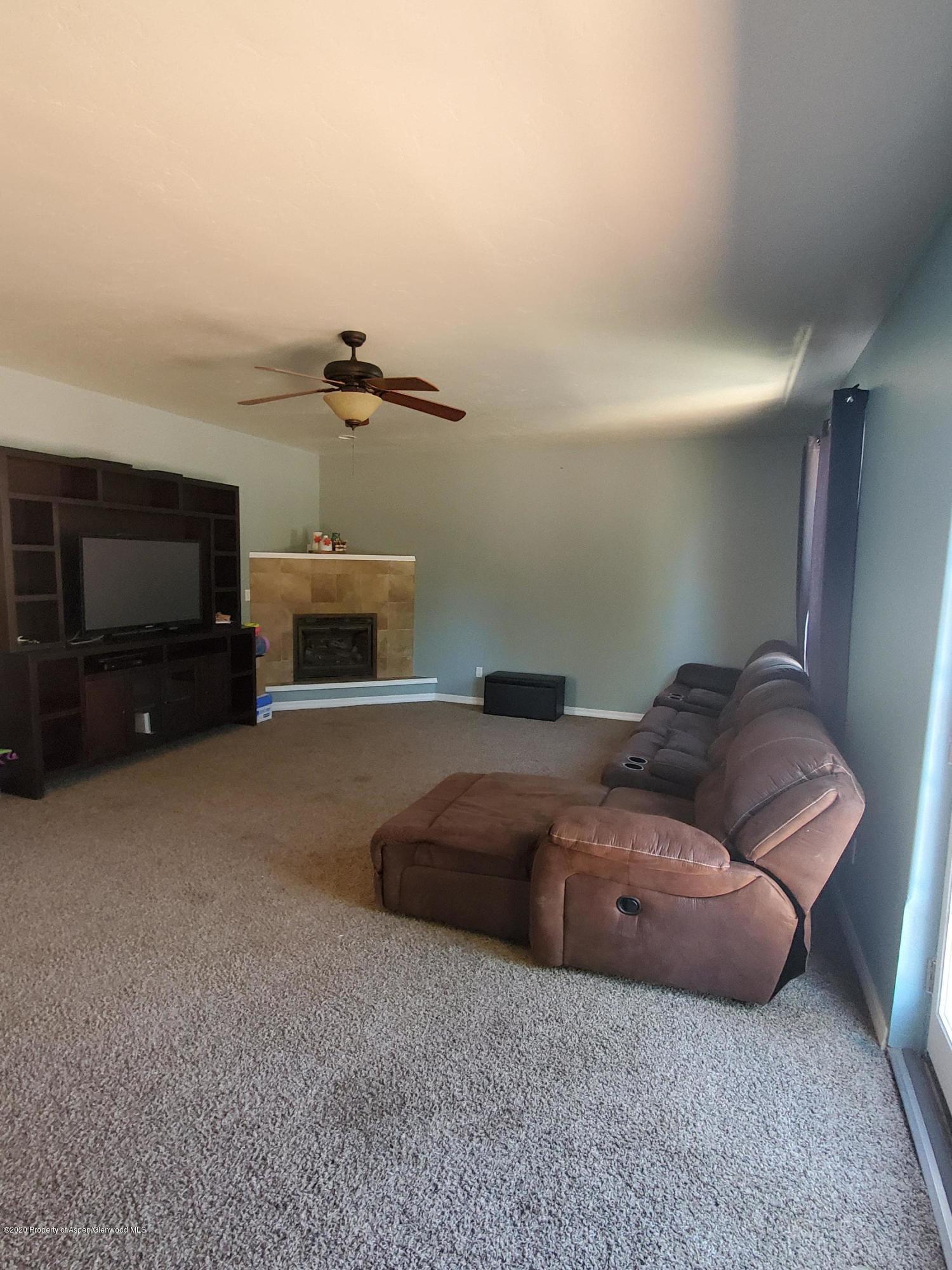 1880 Anvil Court Rifle, CO 81650 - Photo 6 of 16 a living room with furniture and a flat screen tv