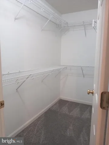 a view of wooden floor and white walls