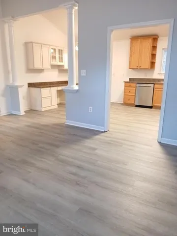 a view of a kitchen with a sink and a window