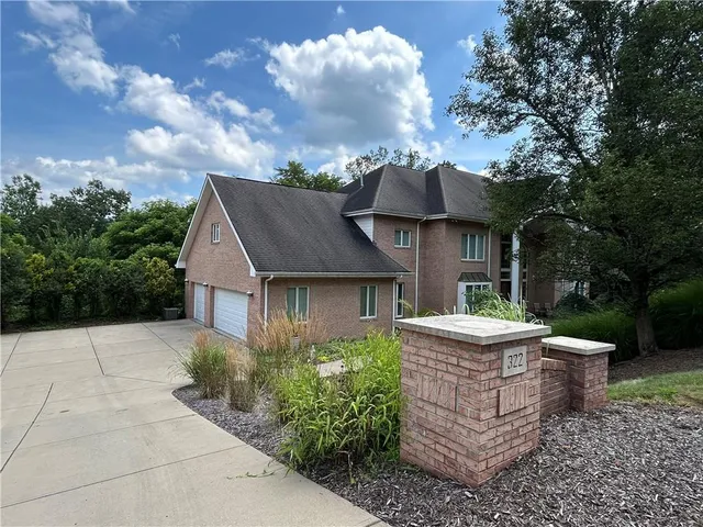 a view of an house with backyard space and garden
